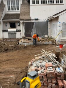 Demo Leaders crew leveling soil before hardscape installation at Crescenda St in Los Angeles _ Demoleaders